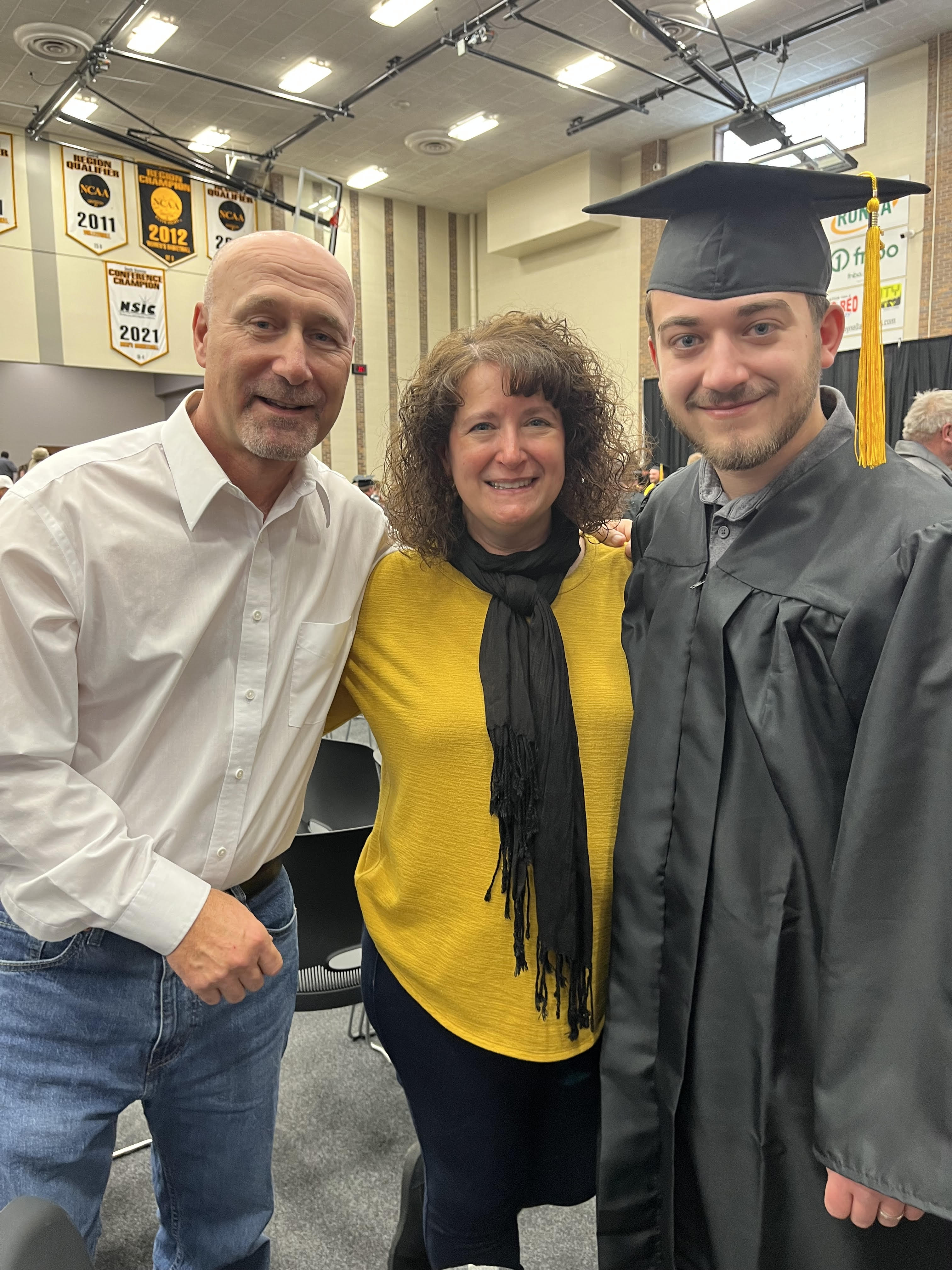 Kristin, her husband Joe, and her son Nic at Nic's college graduation