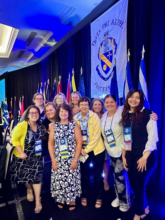 Attending Theta Phi Alpha’s National Convention in Baltimore.